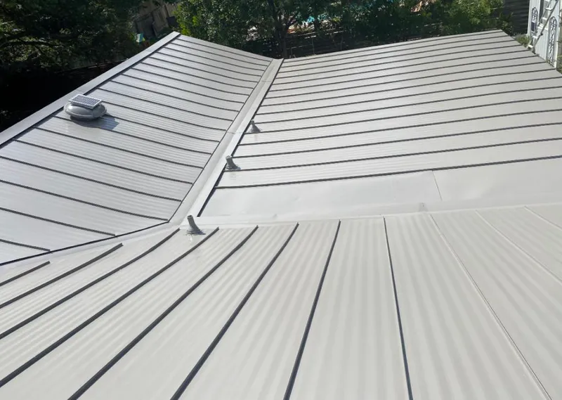 Solar attic fan installed on a metal roof for Roof Ventilation in Carmel